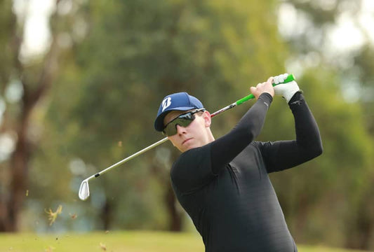 Golfer wearing IceRays UPF 50+ sun protective arm sleeves